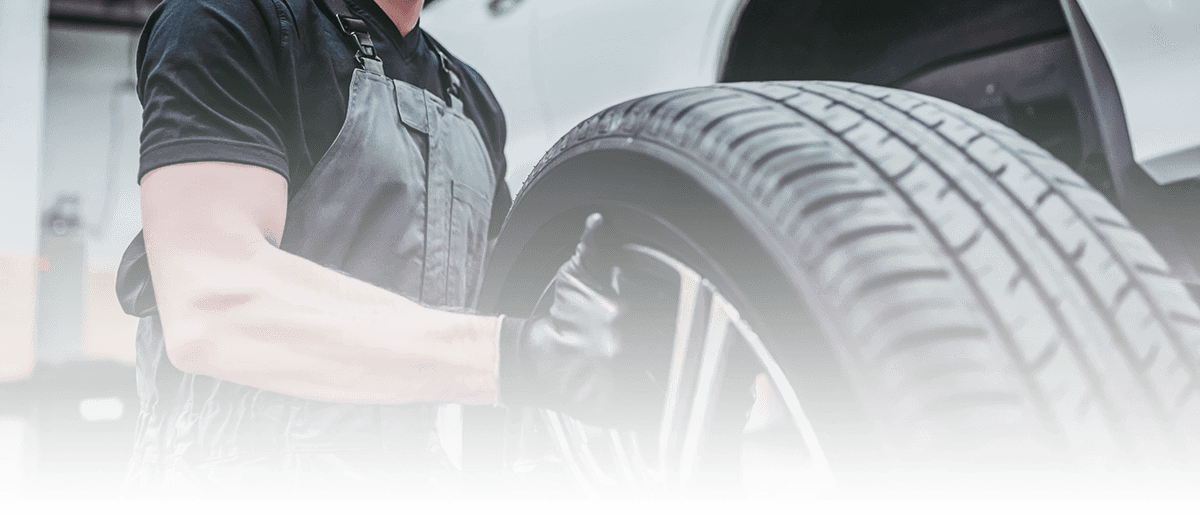 Mechanic holding a tire