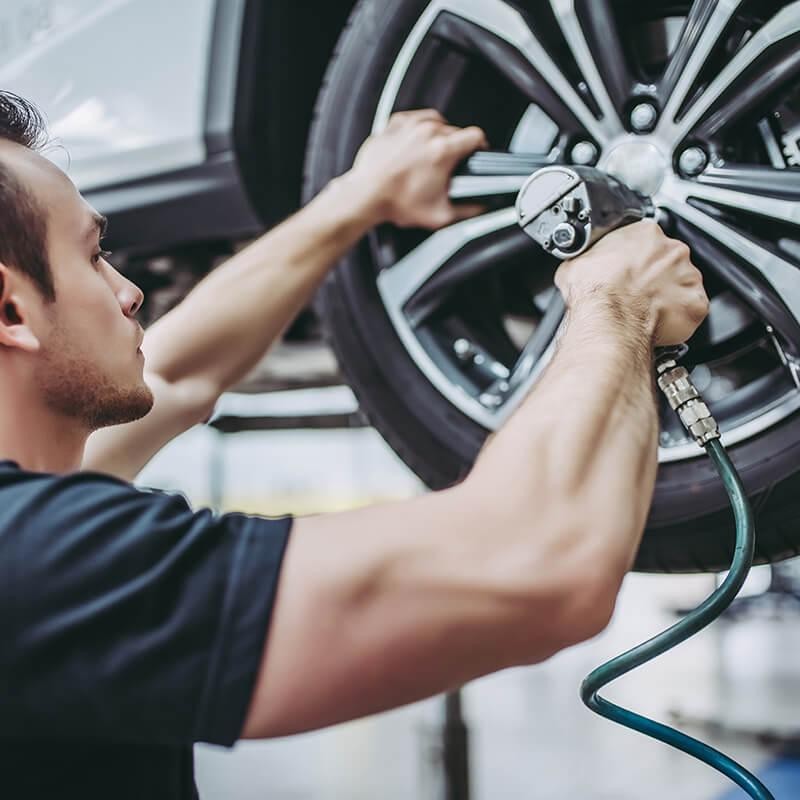 Mechanic fixing a tire