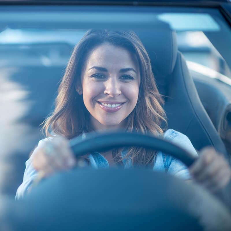 Woman driving a vehicle