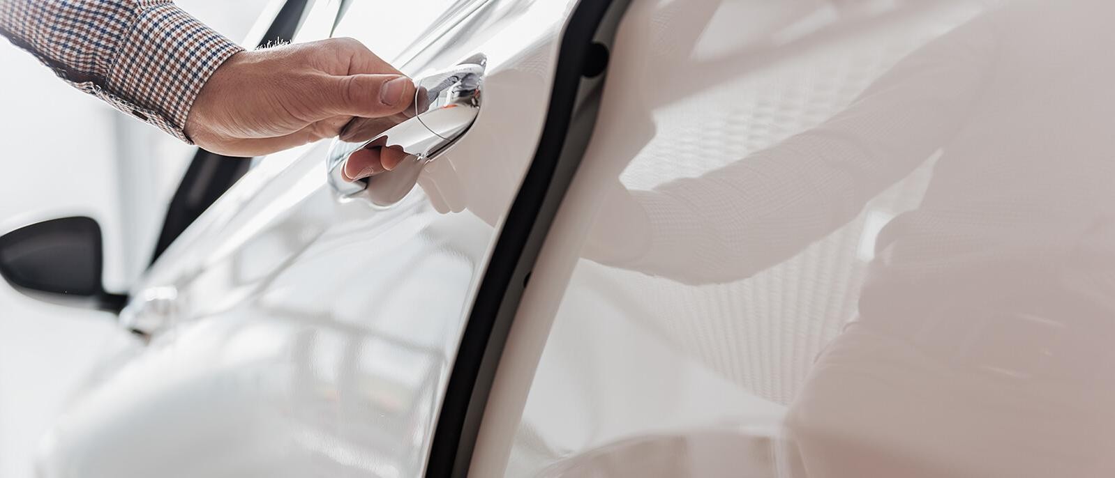 A man opening a car door