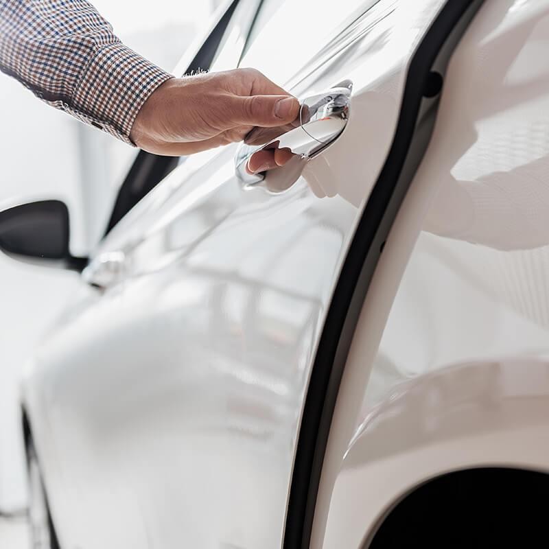 A man opening a car door