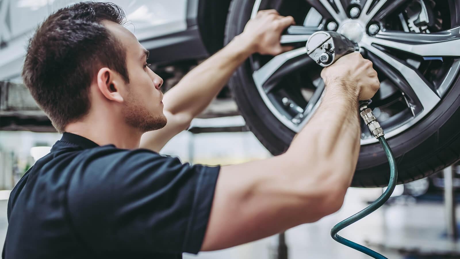 Mechanic fixing a tire