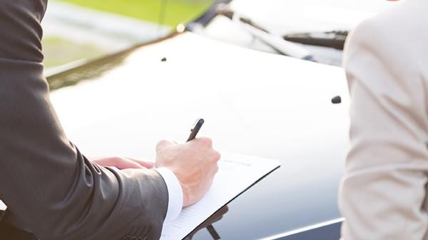 Man signing a finance application