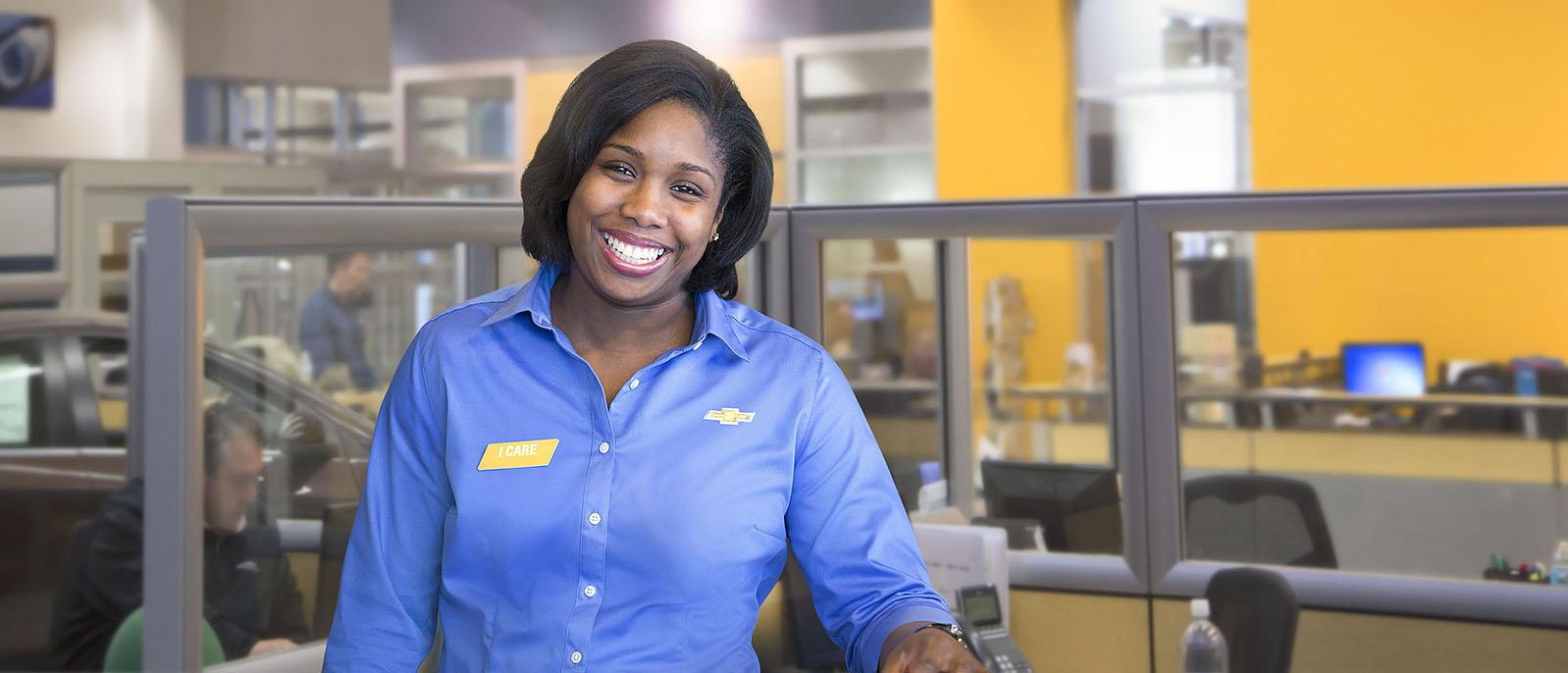 Smiling woman, Chevrolet dealership employee