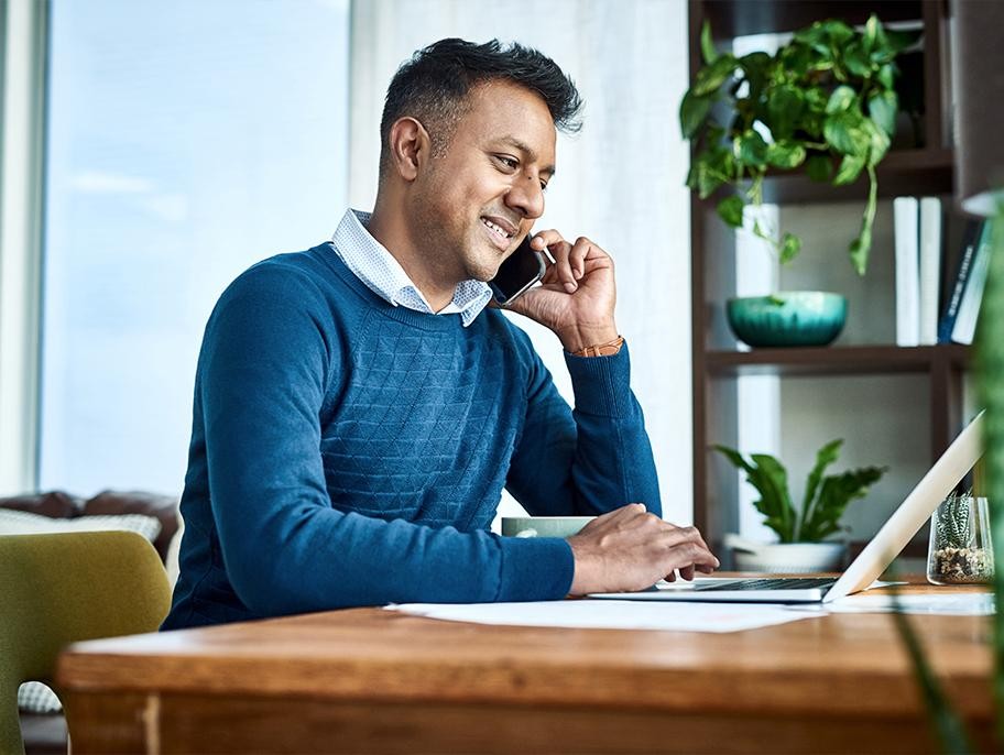 Man working on laptop on tailgate