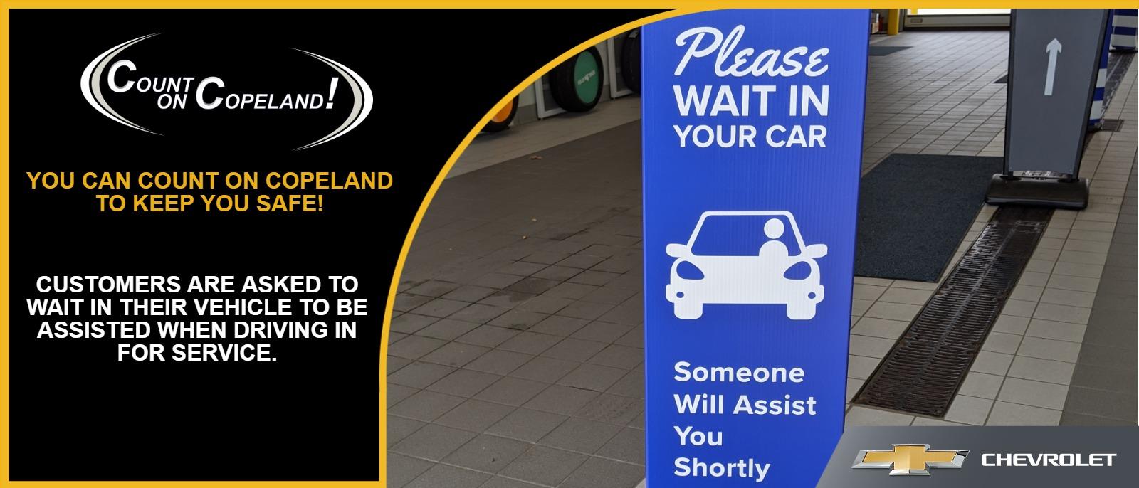 Please wait in your vehicle to be assisted.