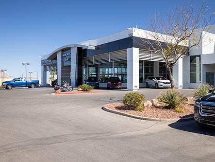 Smiling Women at dealership on phone