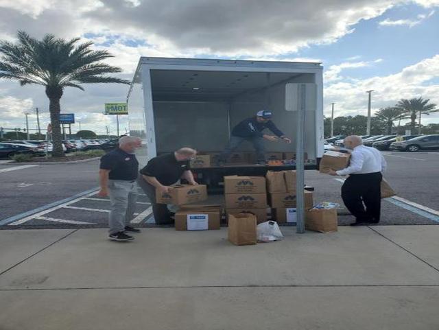 Loading truck to donate food & supplies to metropolitan ministries
