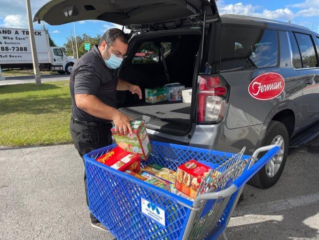 Loading Ferman Van with donation groceries for Metropolitan Ministries