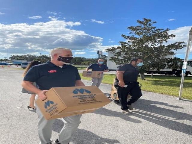 Team Ferman Tarpon carrying boxes of Hope for donation