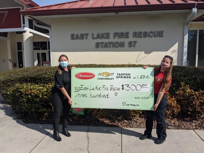 Ferman Donates $300 to East Lake Fire Rescue - Station 57. | Accepted by Fire and Safety Instructor Claudia.
