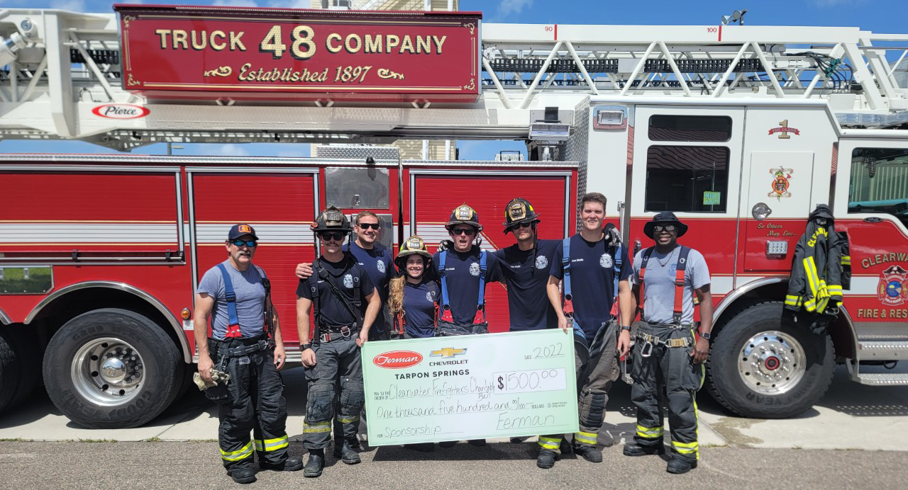 Clearwater Firefighters receive sponsorship check from Ferman Automotive