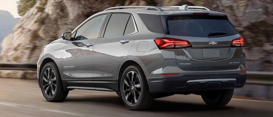 Grey 2023 Chevy Equinox driving