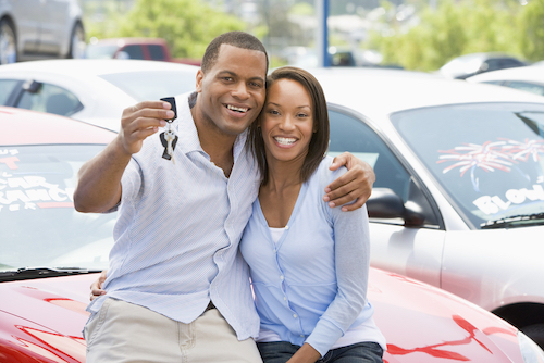 African American couple buying a car