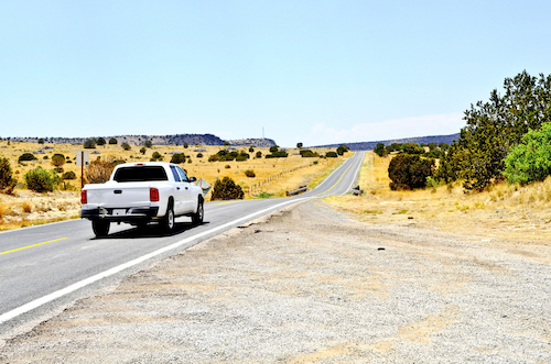 used truck traveling on a two lane highway