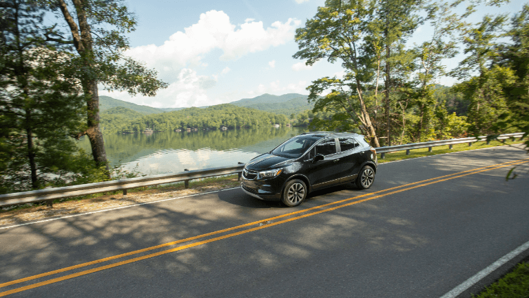 2021 Buick Encore exterior driving by lake