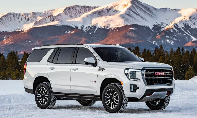 2024 GMC Yukon exterior in front of snowy mountains