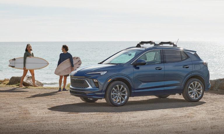 2024 Buick Encore GX exterior at beach with surfers