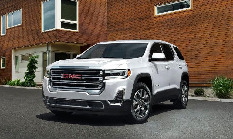 2023 GMC Acadia exterior in front of apartment building