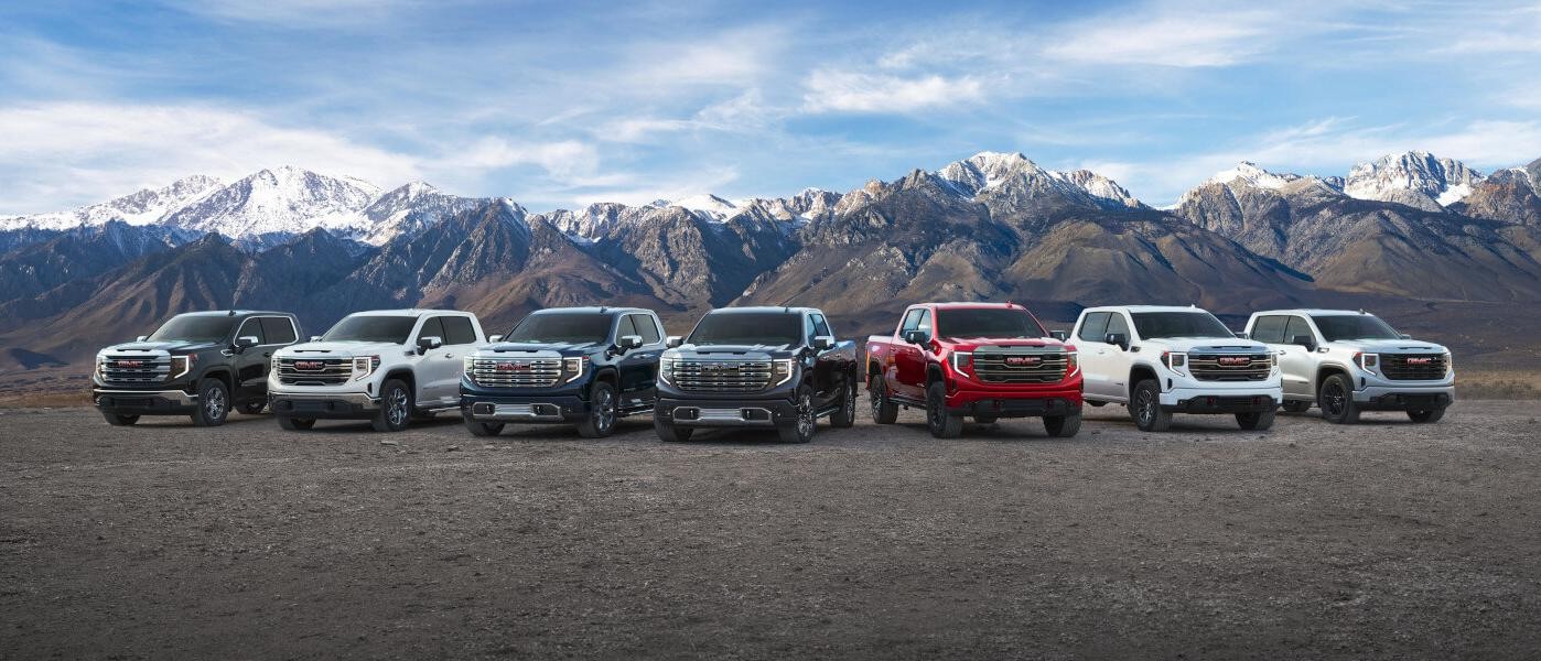 2024 GMC Sierra 1500 model lineup in front of mountain range