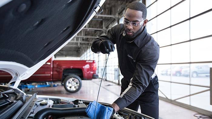 Service Technician performing an oil change