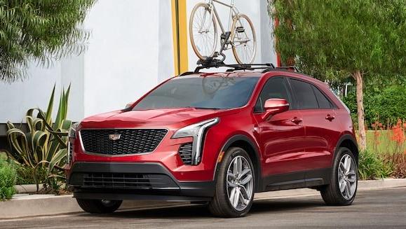 Cadillac XT4 sitting in driveway with infrared tintcoat paint color