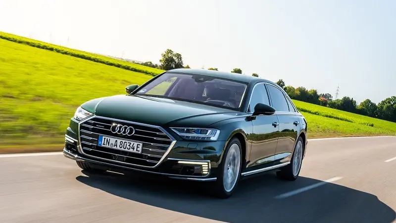 Audi A8 hybrid driving on a track