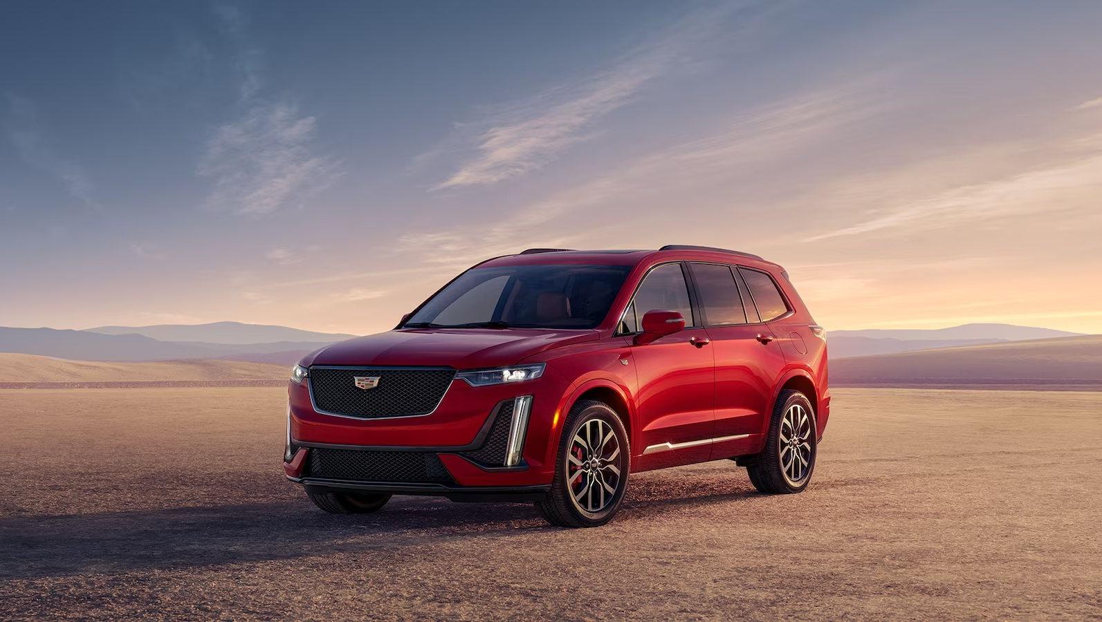 red 2024 Cadillac XT6 parked in a desert