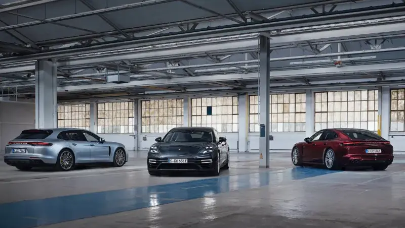 Three Luxury Hybrids parked in a warehouse