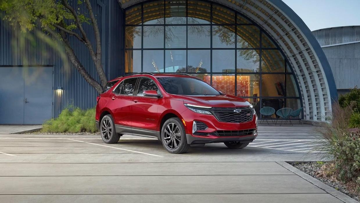 red 2024 Chevy Equinox parked in a driveway