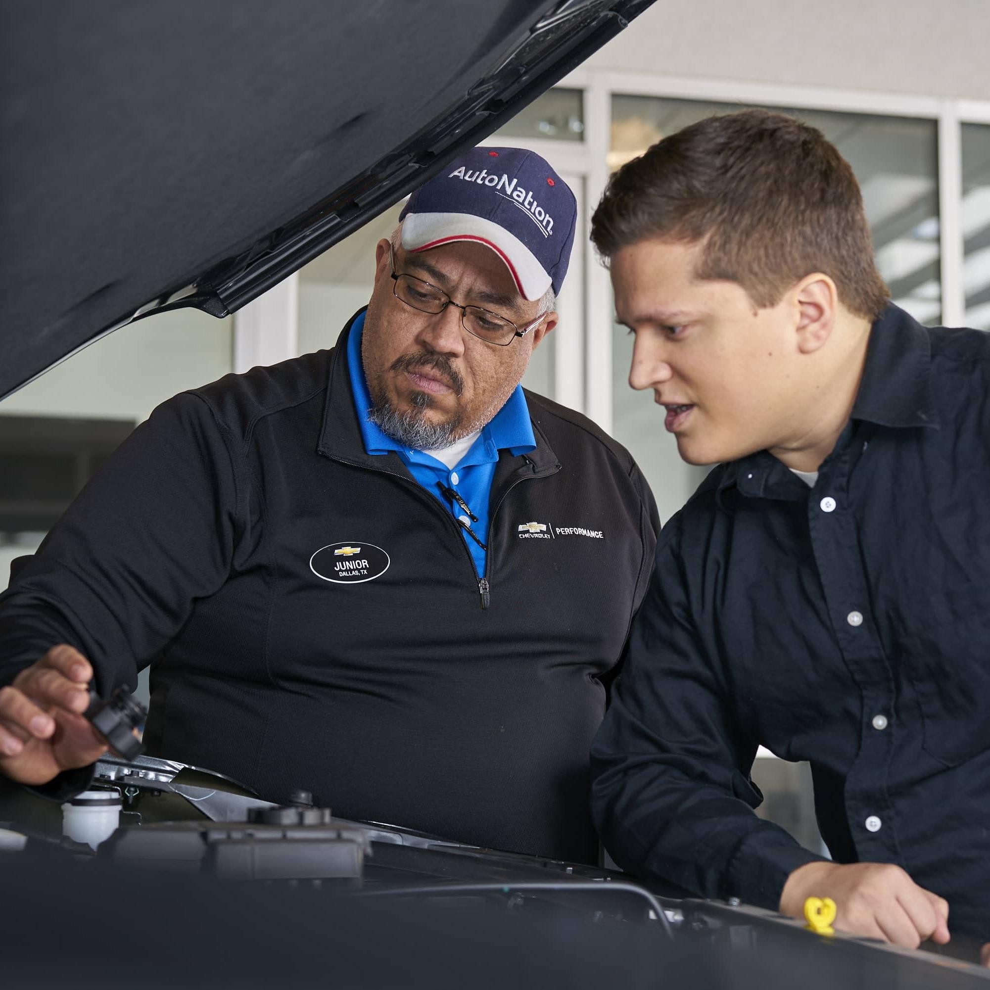 Mechanic checking the pressure on a tire