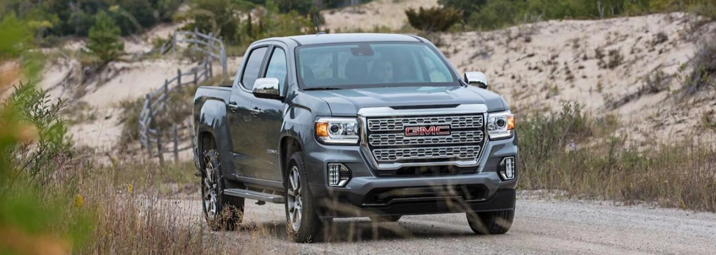 2021 GMC Canyon driving down gravel road