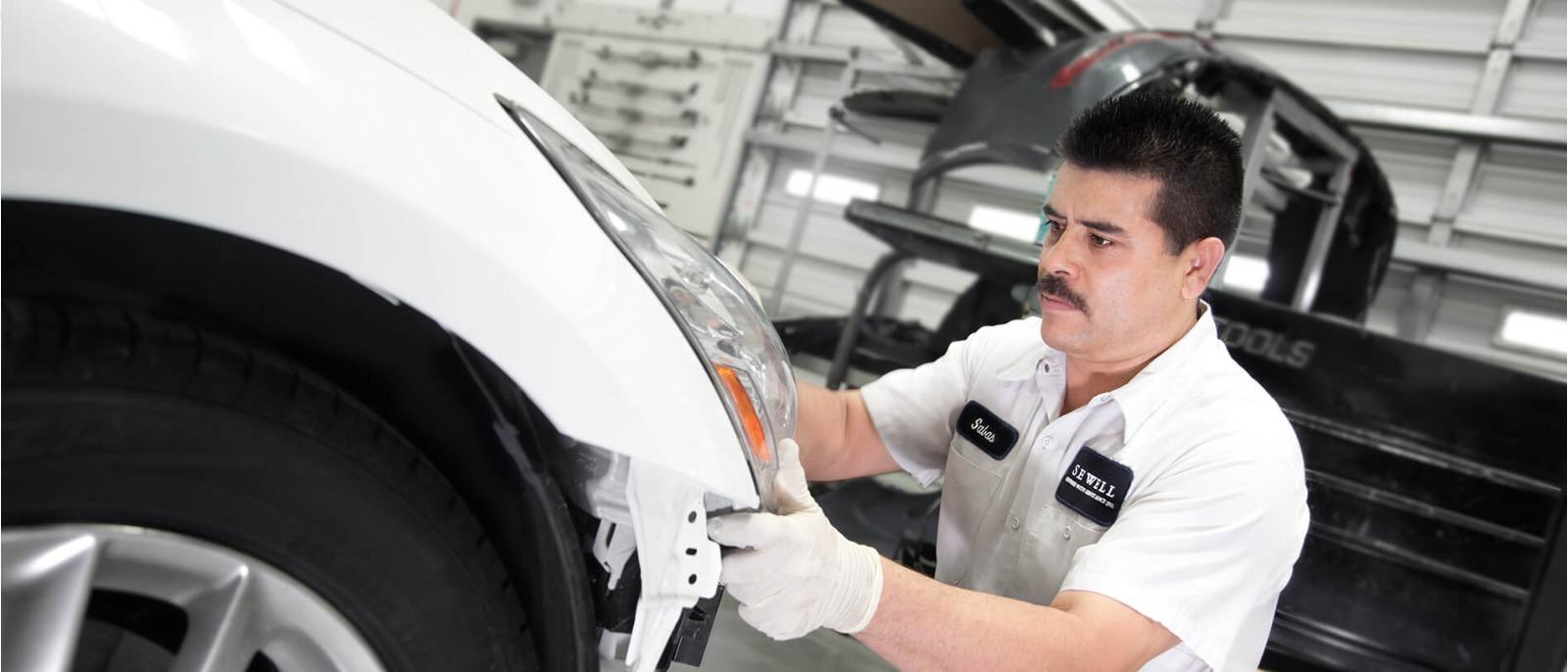 Sewell Collision Repair Process: Service Technician diagnosing an engine