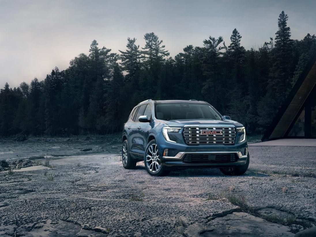 A 2024 GMC Acadia SUV is on display.