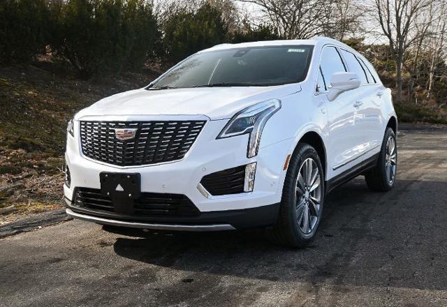 2024 Cadillac XT5 Crystal White parked on the road
