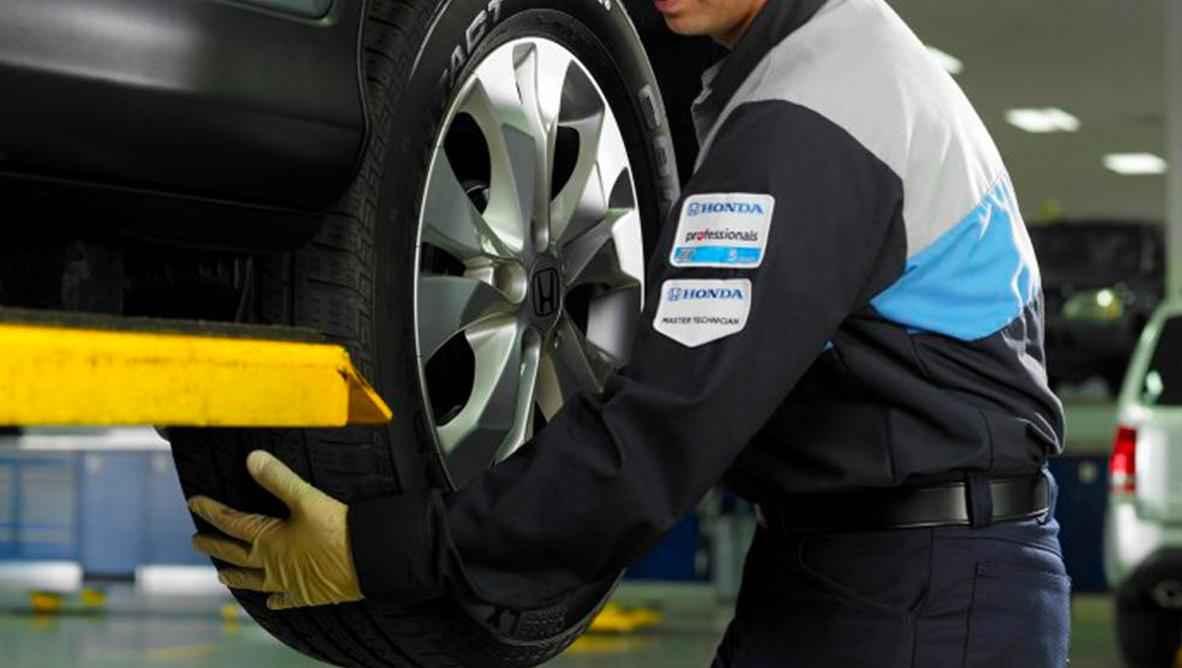 Technician working on Tire