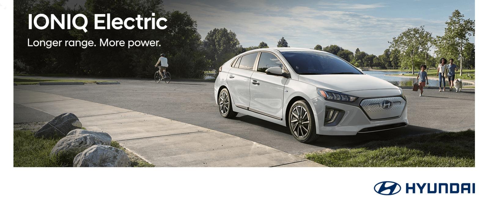 A White Hyundai IONIQ Electric parked on a road side