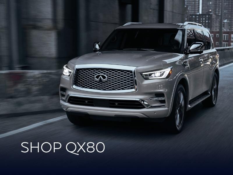 2024 QX80 Silver on a city street