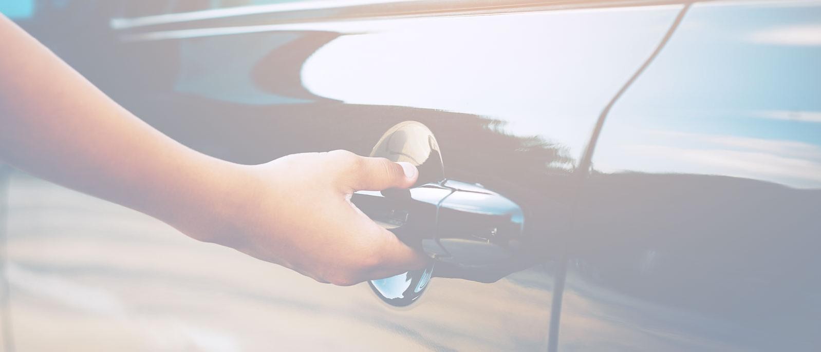 Customer holding car door handle