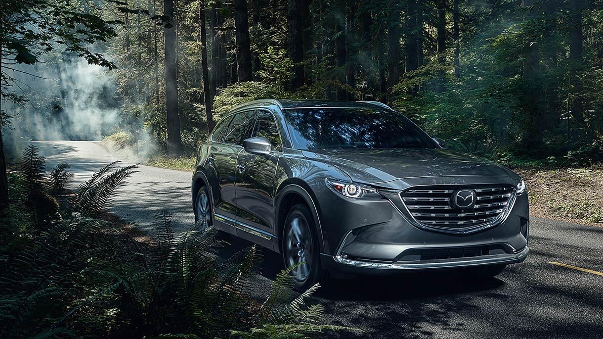 2021 Mazda CX-9 driving in forest.
