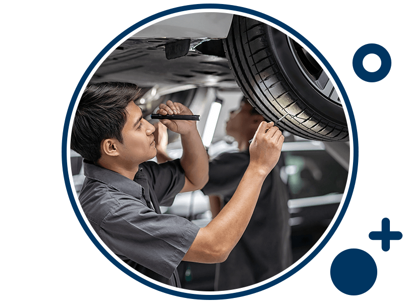 Service technician doing a tire inspection