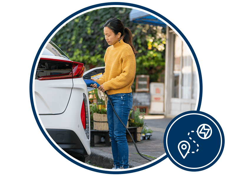 Woman charging vehicle