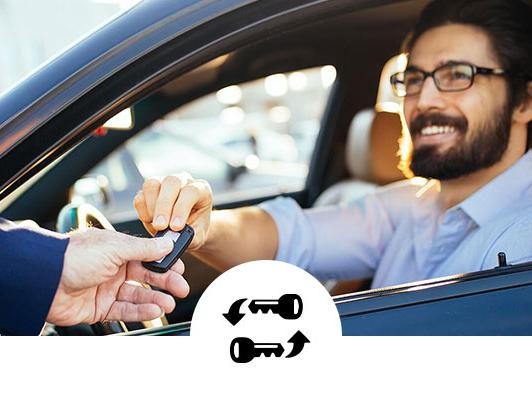 Man taking the keys to his new car with swapping keys icon