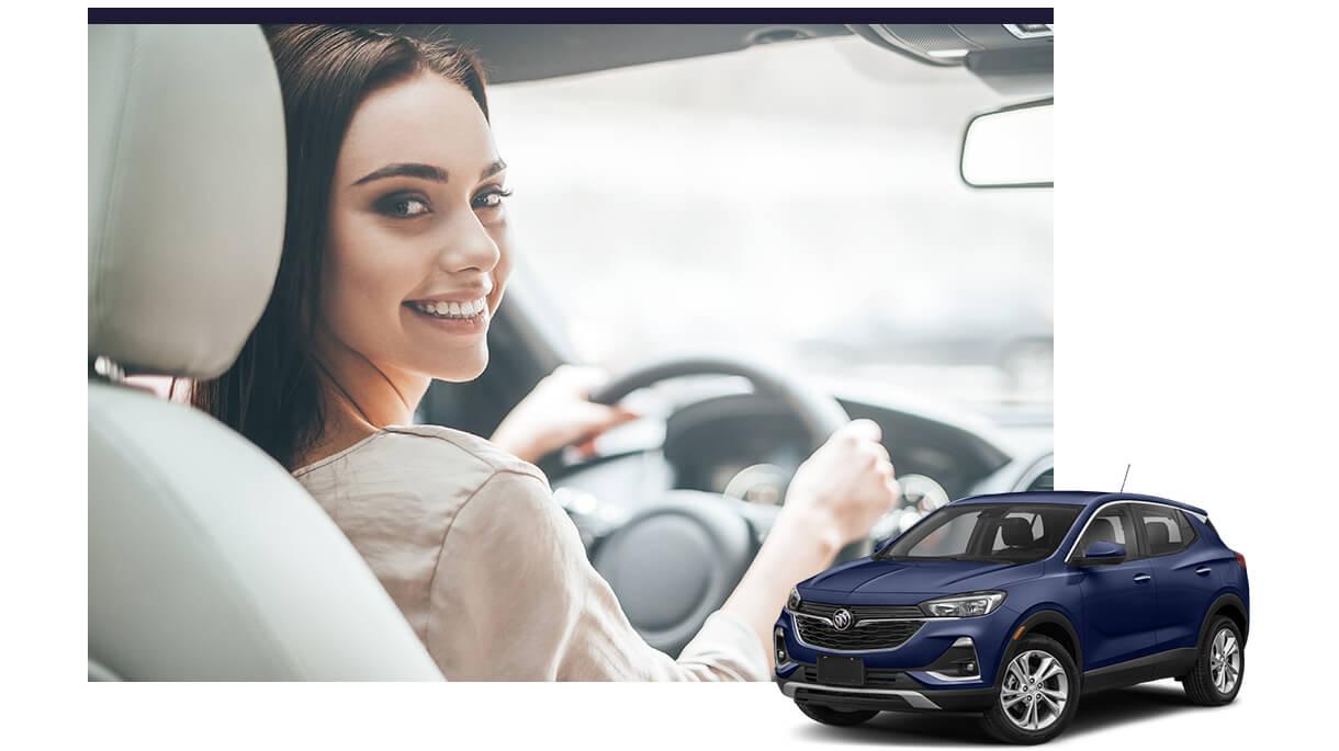 Blue Buick Encore GX with a smiling woman in the driver's seat of a vehicle in the background