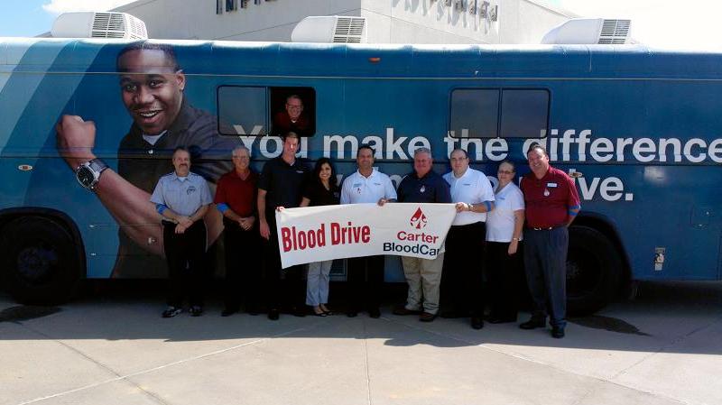 Team in front of a blood drive truck - Carter Blood Care