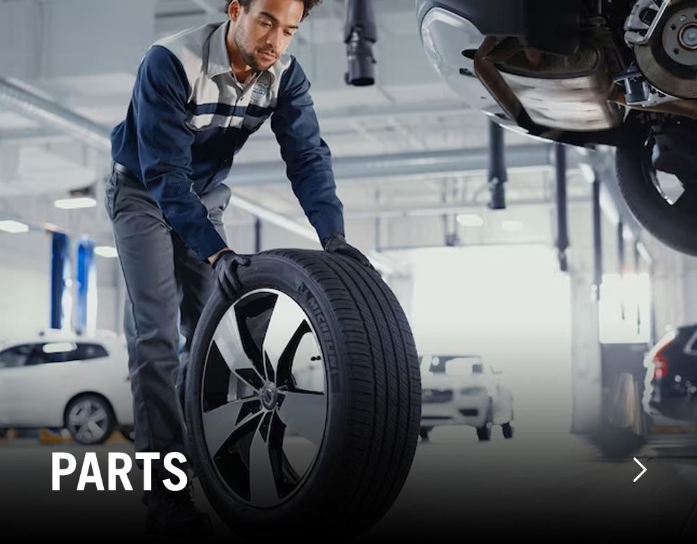 Man putting on new tire