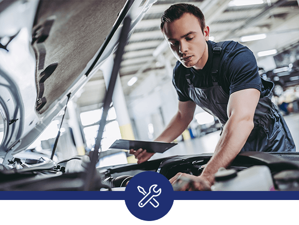 Service technician working on a car.