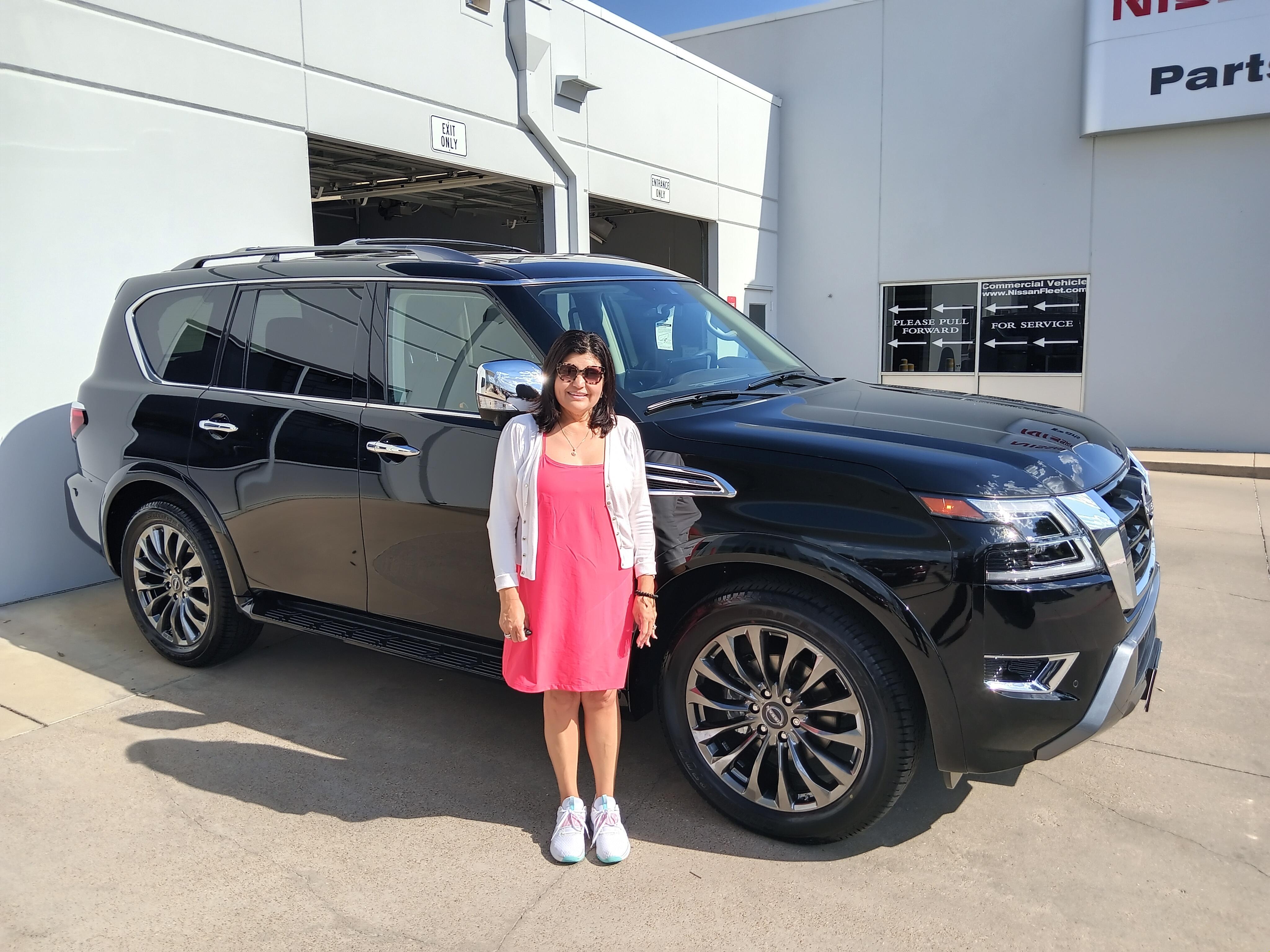 Carmen Coy from Weatherford with her new Armada, helped by Sales Professional Crockett Polich