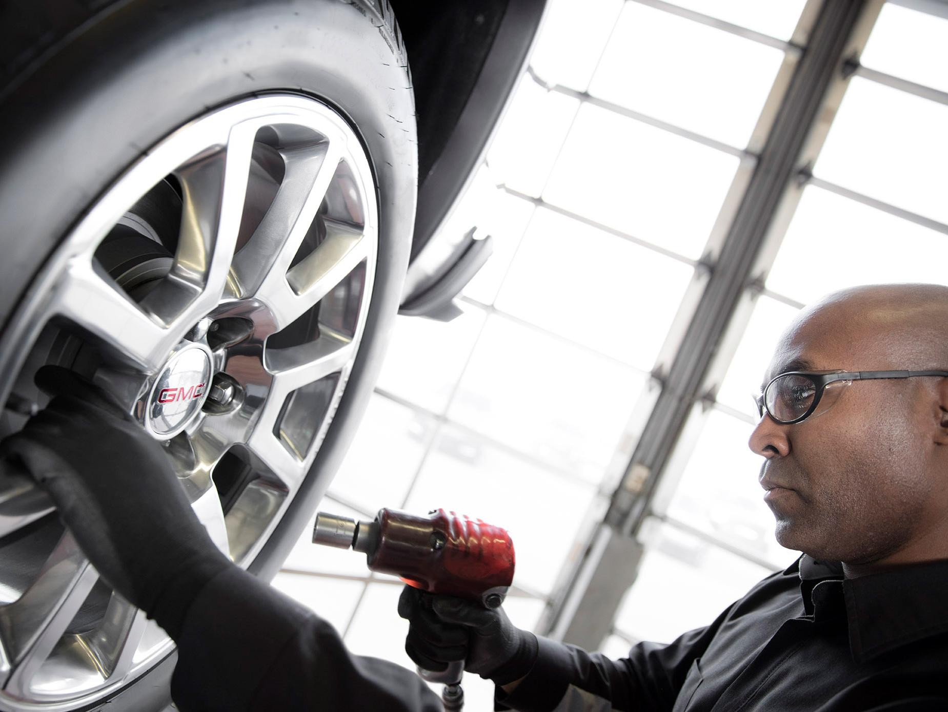 GMC Tech Fixing Tires