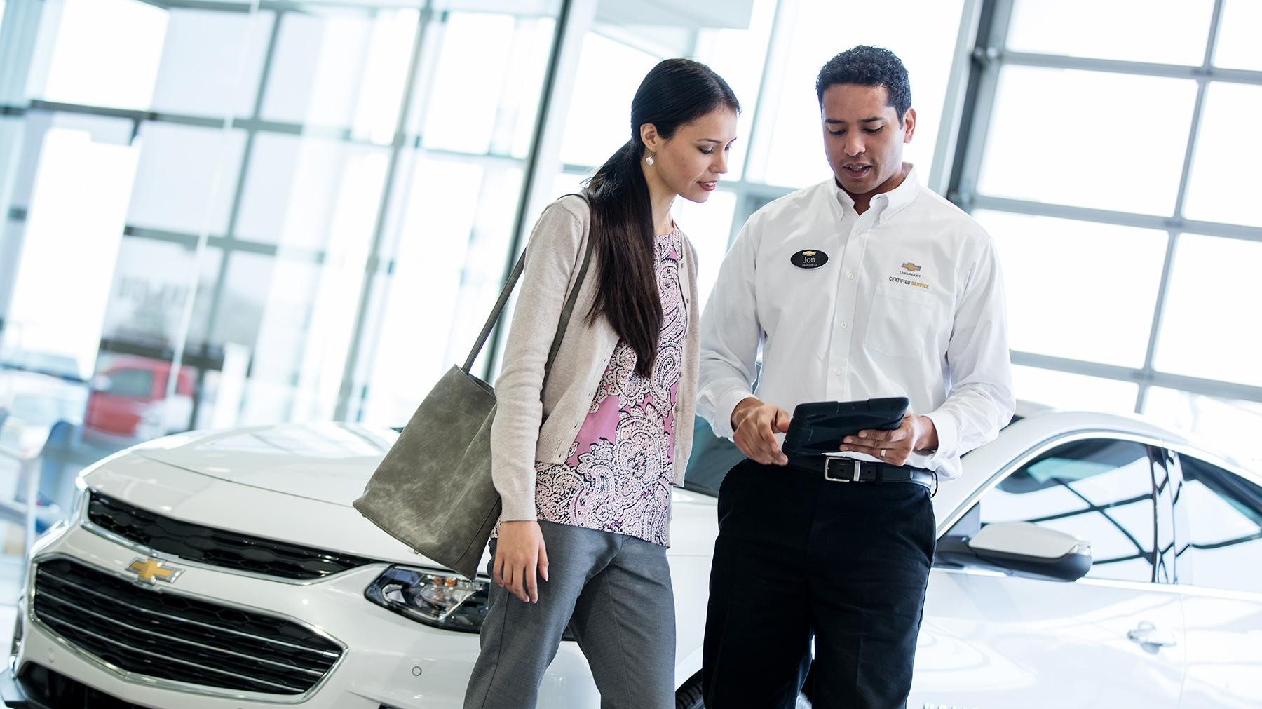 Chevrolet service representative speaking with customer